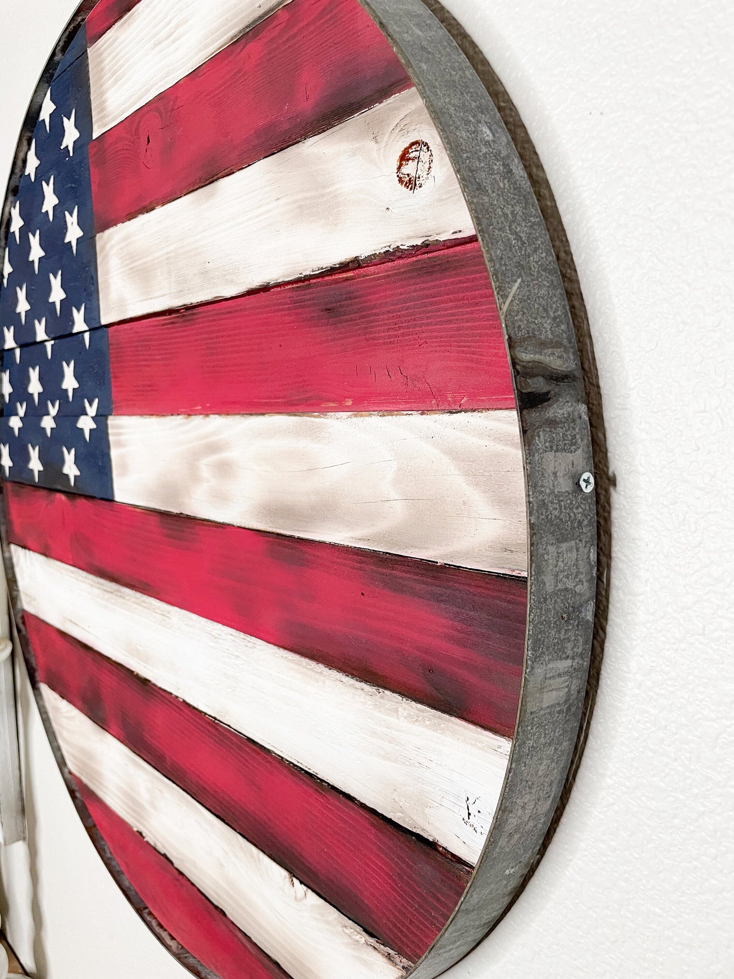 American Flag in wine barrel ring.  Rustic, burned, reclaimed wood flag