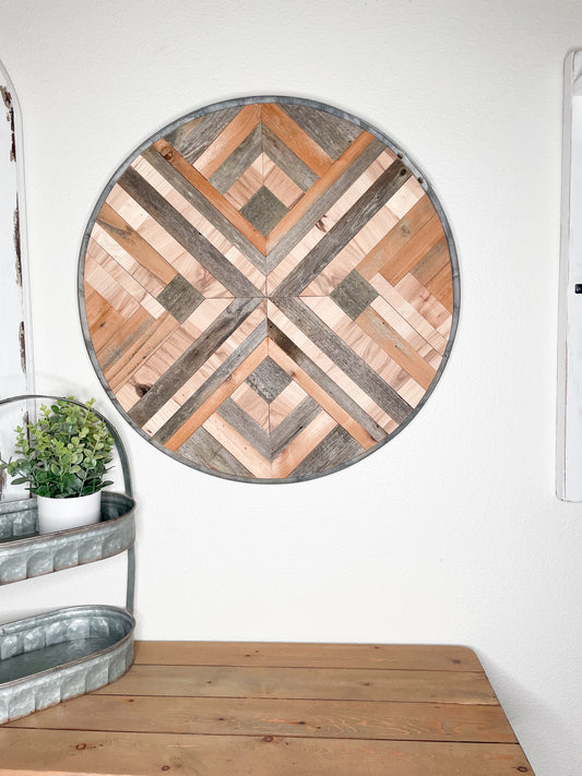 Wood wall art with metal whiskey barrel ring frame